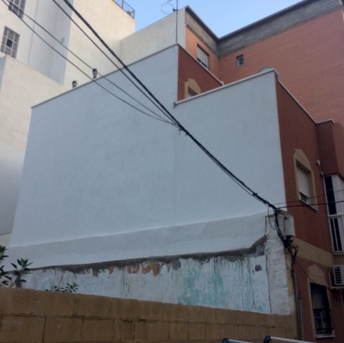 Aislamiento térmico en cubierta y medianería en calle Sicardo (Almería)